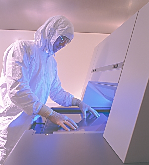 Loading film on one of our 2 laser photoplotters